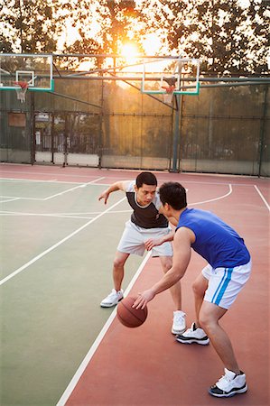 pitcher (sports) - Two street basketball players on the basketball court Stock Photo - Premium Royalty-Free, Code: 6116-06939364