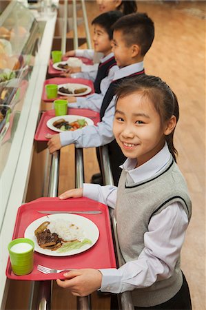 simsearch:6116-06939469,k - School children standing in line in school cafeteria Photographie de stock - Premium Libres de Droits, Code: 6116-06939461