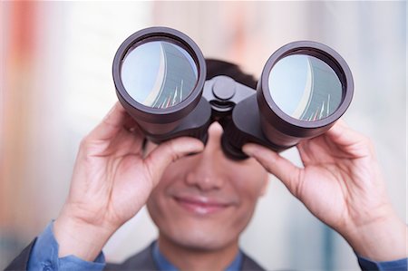 portrait ethnic asia - Young businessman looking through binoculars, Beijing Stock Photo - Premium Royalty-Free, Code: 6116-07084866