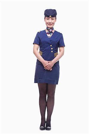 Full length portrait of air stewardess Stock Photo - Premium Royalty-Free, Code: 6116-07084886