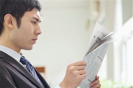 simsearch:6116-07084811,k - Businessman Reading Newspaper Stock Photo - Premium Royalty-Free, Code: 6116-07084806