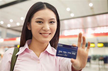 front of train and platform people - Businesswoman Showing Credit Card Stock Photo - Premium Royalty-Free, Code: 6116-07084811