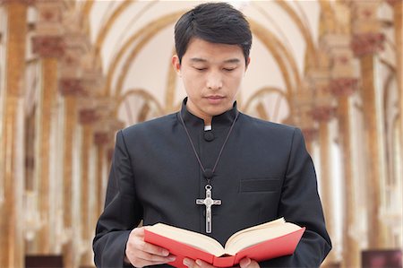 Priest Looking at Bible in a Church Stock Photo - Premium Royalty-Free, Code: 6116-07084986