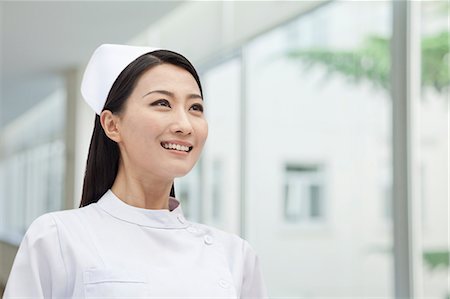 Portrait of Nurse, China, horizontal Stock Photo - Premium Royalty-Free, Code: 6116-07084930