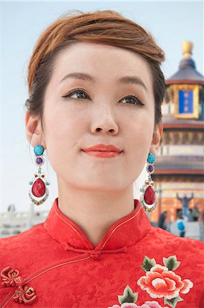 Young Woman with Qipao Stock Photo - Premium Royalty-Free, Code: 6116-07085040