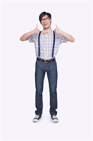 Young Man Giving the Thumbs Up Stock Photo - Premium Royalty-Free, Code: 6116-07085044