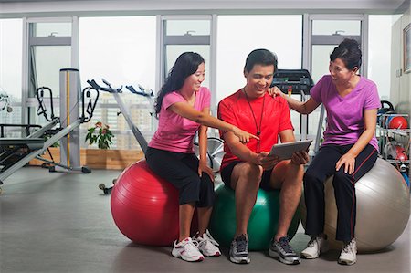 equity - People looking at digital tablet in the gym Stock Photo - Premium Royalty-Free, Code: 6116-07085448