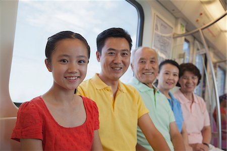 simsearch:6116-06939008,k - Family sitting in the subway, portrait Stock Photo - Premium Royalty-Free, Code: 6116-07085428