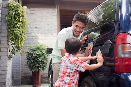 father teaching son - Father and Son Clean their Minivan Together Stock Photo - Premium Royalty-Free, Code: 6116-07085541