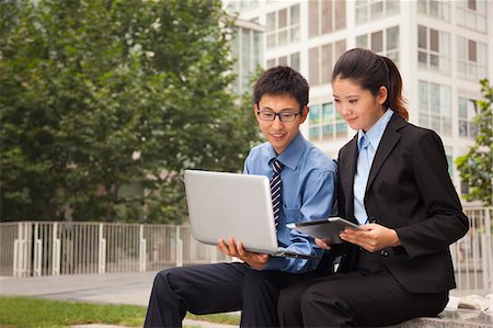 Businessman and businesswoman working outdoors Stock Photo - Premium Royalty-Free, Code: 6116-07085573