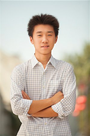 Portrait of Young Man in Nanluoguxiang, Beijing, China Photographie de stock - Premium Libres de Droits, Code: 6116-07085810