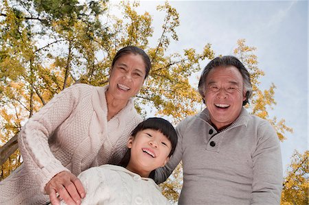 Grandparents and granddaughter in park Stock Photo - Premium Royalty-Free, Code: 6116-07086048