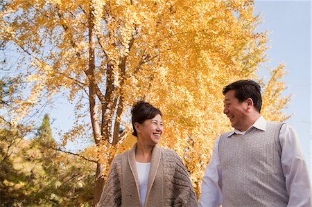 Mature Couple Walking in the Park Stock Photo - Premium Royalty-Free, Code: 6116-07086080