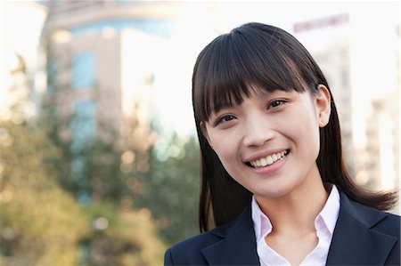 simsearch:6116-07084811,k - Young Businesswoman  Looking at Camera Stock Photo - Premium Royalty-Free, Code: 6116-07235389