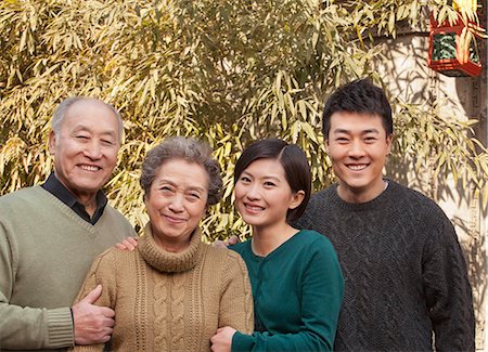 simsearch:6116-07235720,k - Family Portrait in front of Bamboo Stock Photo - Premium Royalty-Free, Code: 6116-07235534