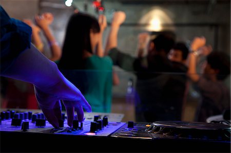 A view from DJ's deck of a crowd dancing in nightclub, Stock Photo - Premium Royalty-Free, Code: 6116-07235656