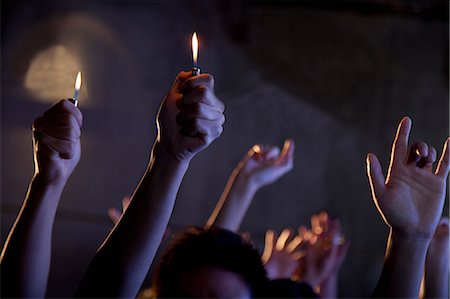 simsearch:6116-07236256,k - Group of people holding cigarette lighters at a concert Stock Photo - Premium Royalty-Free, Code: 6116-07235670