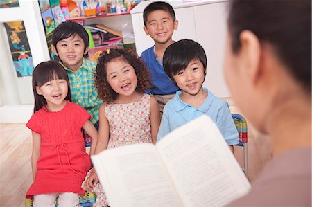 students reading in groups - Teacher Reading to Her Students Stock Photo - Premium Royalty-Free, Code: 6116-07235603