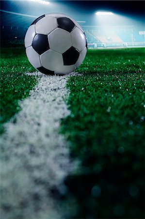 stadium at night - Soccer field with soccer ball and line, side view Stock Photo - Premium Royalty-Free, Code: 6116-07236133