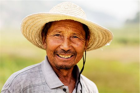 farm active - Portrait of smiling farmer, rural China, Shanxi Province Stock Photo - Premium Royalty-Free, Code: 6116-07236516