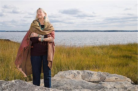 simsearch:400-04016023,k - Senior woman standing near a lake Stock Photo - Premium Royalty-Free, Code: 6116-08915168