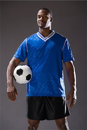 Footballer Stock Photo - Premium Royalty-Free, Code: 6116-08915706