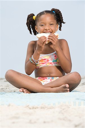 Girl eating sandwich Stock Photo - Premium Royalty-Free, Code: 6116-08915840