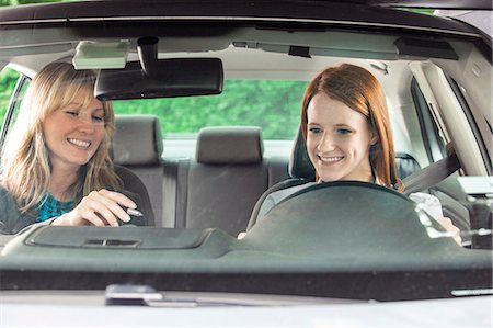 sedan (vehicle) - Teenager in car with driving instructor Stock Photo - Premium Royalty-Free, Code: 6116-08916046