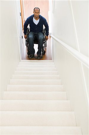 simsearch:6113-07243220,k - Disabled man trapped at bottom of stairs Stock Photo - Premium Royalty-Free, Code: 6116-09013620