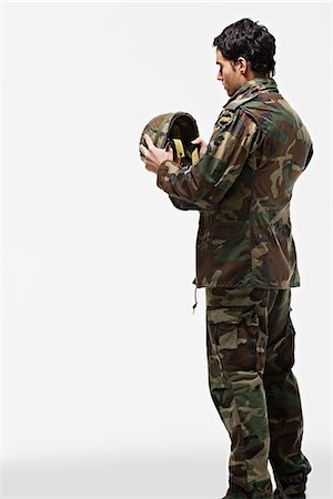 simsearch:841-07202015,k - Soldier putting on helmet Stock Photo - Premium Royalty-Free, Code: 6116-09013739