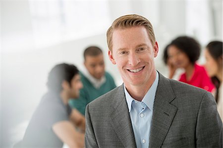 Business Meeting. A Man Smiling Confidently. Stock Photo - Premium Royalty-Free, Code: 6118-07122630