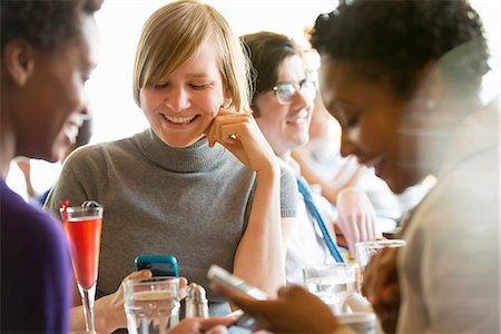 simsearch:6118-07121993,k - City Life. A Group Of People In A Café, Checking Their Smart Phones. Stock Photo - Premium Royalty-Free, Code: 6118-07122823