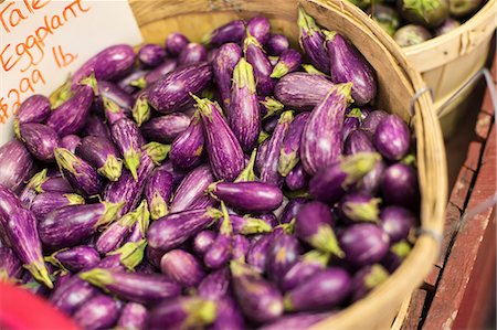 simsearch:614-06169178,k - A farm growing and selling organic vegetables and fruit. A basket of small egg plant, aubergines. Stock Photo - Premium Royalty-Free, Code: 6118-07202981
