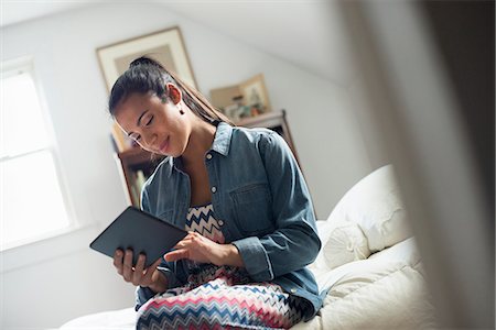 simsearch:6118-07203820,k - A young woman using a digital tablet. Stock Photo - Premium Royalty-Free, Code: 6118-07203833
