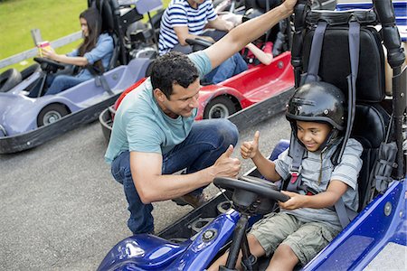 picture of man riding a cart - Boys and men go-karting on a track. Stock Photo - Premium Royalty-Free, Code: 6118-07235147