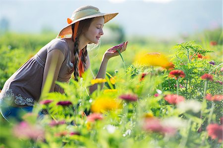 simsearch:6118-07351124,k - Summer on an organic farm. A young woman in a field of flowers. Stock Photo - Premium Royalty-Free, Code: 6118-07351113