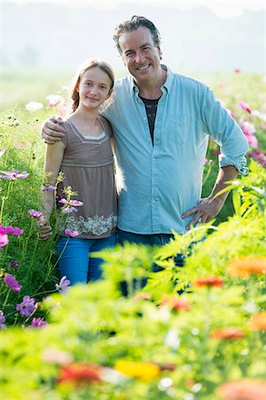 simsearch:6118-07351124,k - Summer on an organic farm. A man and a girl in a field of flowers. Stock Photo - Premium Royalty-Free, Code: 6118-07351121