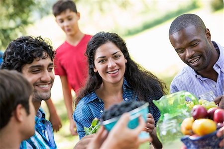 simsearch:6118-07353446,k - Adults and children around a table in a garden. Stock Photo - Premium Royalty-Free, Code: 6118-07351200