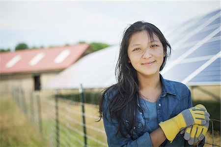 solar panel usa - A young woman on a traditional farm in the countryside of New York State, USA Stock Photo - Premium Royalty-Free, Code: 6118-07352273