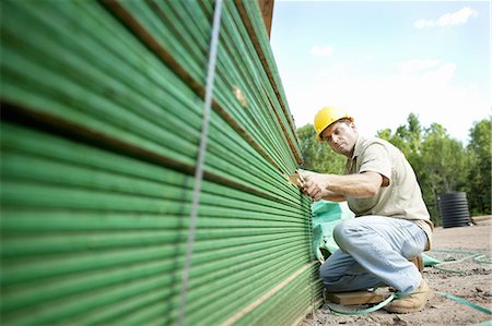 A construction site, a domestic house being built in a rural setting in New York State, USA Stock Photo - Premium Royalty-Free, Code: 6118-07352220