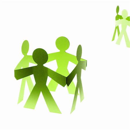 simsearch:6118-07352322,k - Papercuts, paper cut out figures representing people with joined hands. Stock Photo - Premium Royalty-Free, Code: 6118-07352308