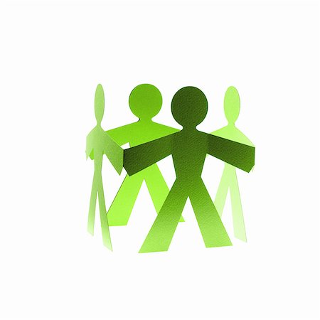 simsearch:6118-07352322,k - Papercuts, paper cut out figures representing people with joined hands. Stock Photo - Premium Royalty-Free, Code: 6118-07352309