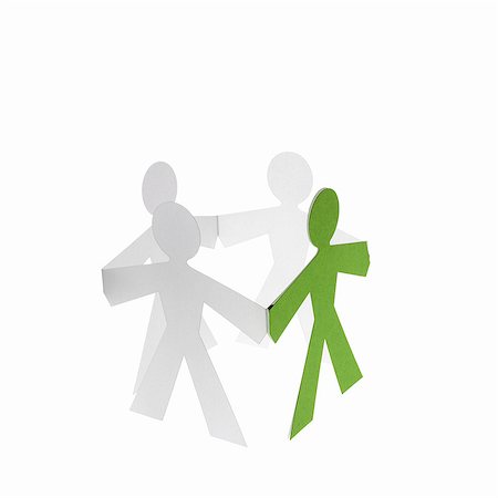 simsearch:6118-07352322,k - Papercuts, paper cut out figures representing people with joined hands. Stock Photo - Premium Royalty-Free, Code: 6118-07352313