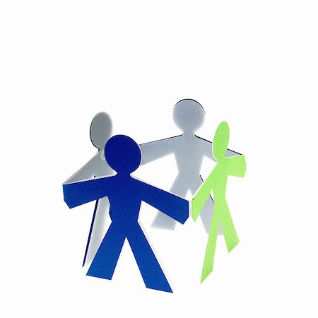 simsearch:6118-07352322,k - Papercuts, paper cut out figures representing people with joined hands. Stock Photo - Premium Royalty-Free, Code: 6118-07352314