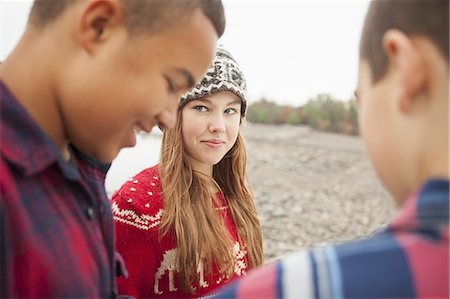 A day out at Ashokan lake. Three young people, teenagers, a girl and two boys. Stock Photo - Premium Royalty-Free, Code: 6118-07353575