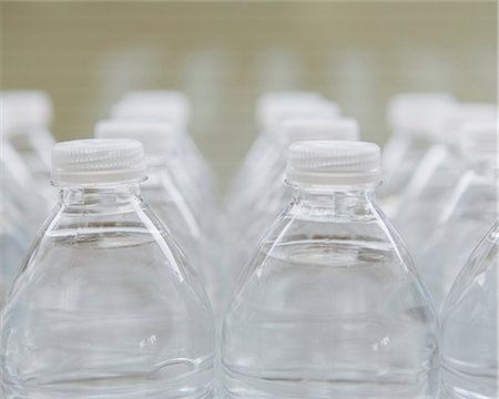 simsearch:6118-07352741,k - Rows of water-filled plastic bottles with screw caps. Stock Photo - Premium Royalty-Free, Code: 6118-07353528