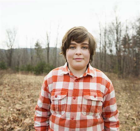 simsearch:6118-07353446,k - A young boy in a red checked shirt outside on a winter's day. Stock Photo - Premium Royalty-Free, Code: 6118-07354111