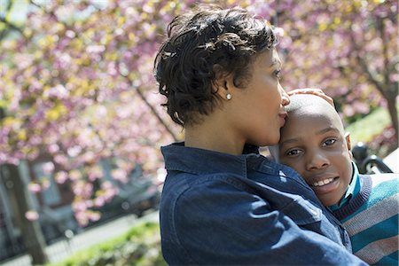 simsearch:6118-07354682,k - A New York city park in the spring. Sunshine and cherry blossom. A mother and son spending time together. Stock Photo - Premium Royalty-Free, Code: 6118-07354675