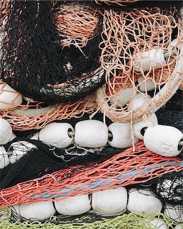 simsearch:6118-08910527,k - Pile of commercial fishing nets, with white floats, on the quayside at Fisherman's Terminal, Seattle. Stock Photo - Premium Royalty-Free, Code: 6118-07440779