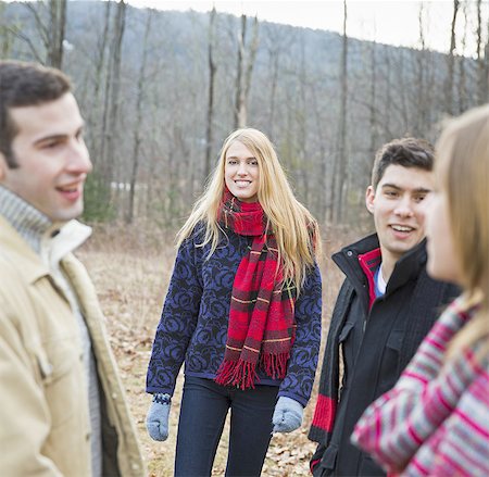 A group of four people outdoors on a winter day. Stock Photo - Premium Royalty-Free, Code: 6118-07440781